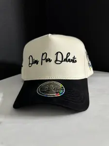 Dios Por Delante Hat with Embroidered Text, Adjustable Fit, Adjustable Strap, and Black Lace Detail