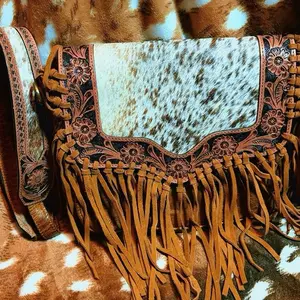 Tooled leather with cowhide and fringe