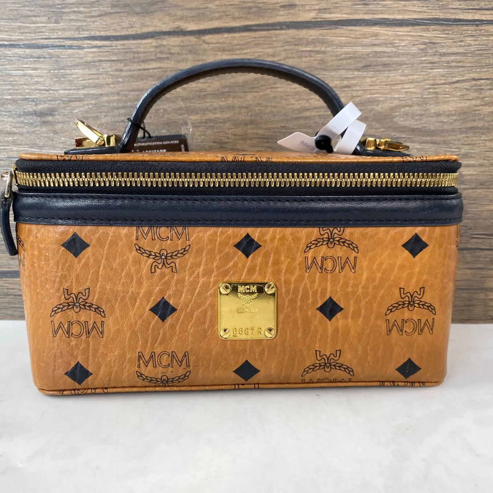Pre-owned MCM leather Shoulder Bags Visetos Cosmetic Case Cognac Visetos Coated Black Trim Gold Tone Hardware+charm+++