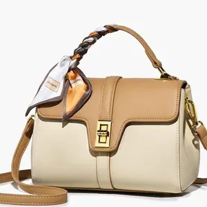 Handbag with Stylish Braided Handle and Gold Buckle Closure in Beige and Cream Colors bag