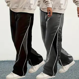 Men's fashion loose-fit pants with side stripe patching. The waist has drawstrings and the bottom has elastic bands. They are perfect for daily casual wear and school season outfits.