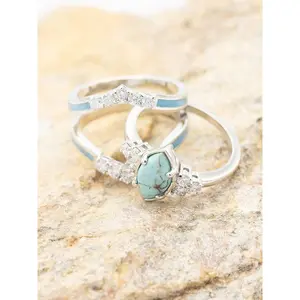 Featuring a stunning hollow design with turquoise and rhinestone accents, this ring makes a meaningful engagement or anniversary gift for your partner