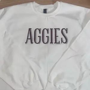 Embroidered Aggies crewneck sweatshirt. College football apparel