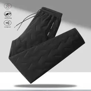 A pair of ribbed casual pants, featuring a versatile casual style, adjustable drawstring waistband for practicality, an overall design that slimmingly flatters, classic black colorway for easy matching, geometric embossed accents perfectly placed, side zi