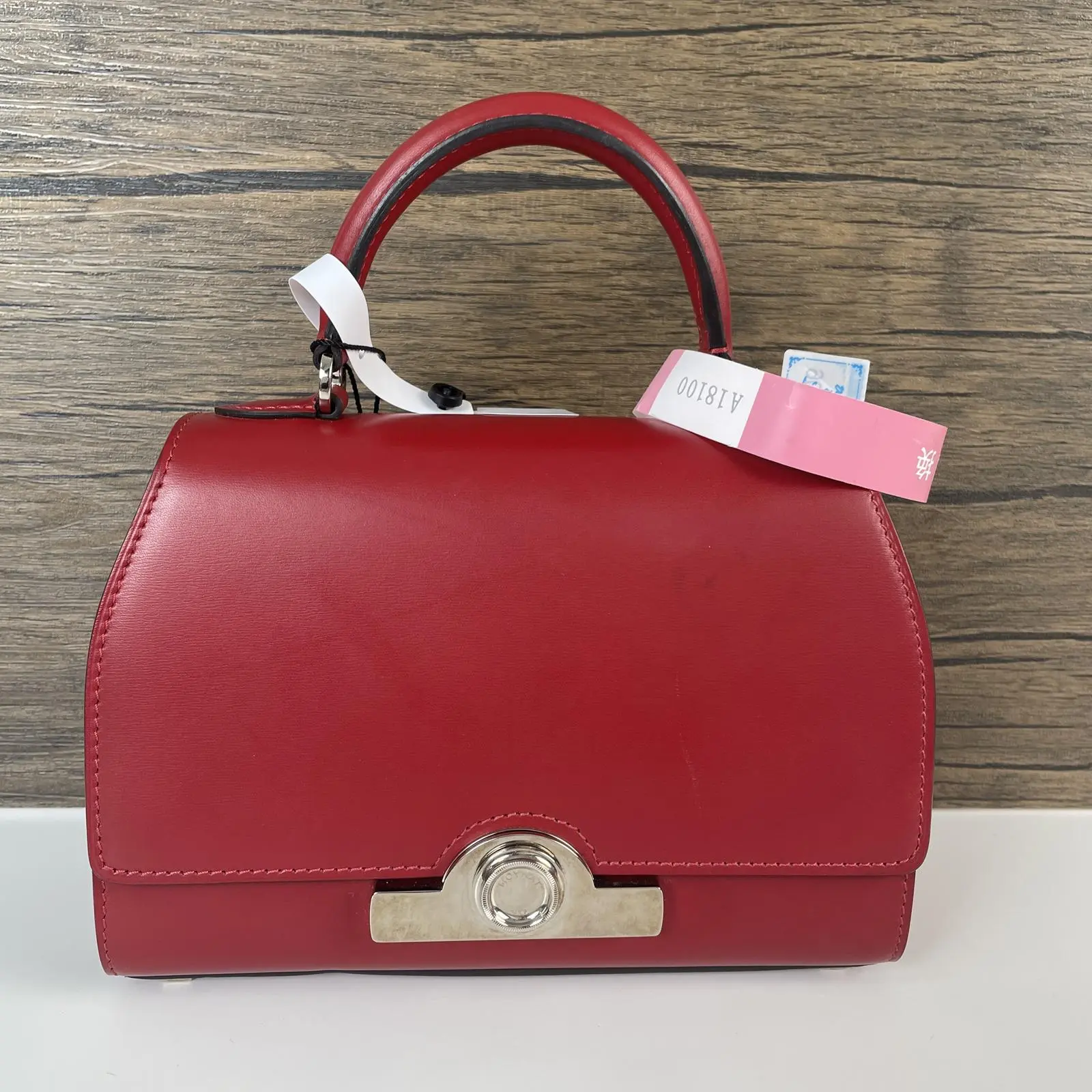 Pre-owned MOYNAT leather handlebag Taurillon Blush Rejane with charm