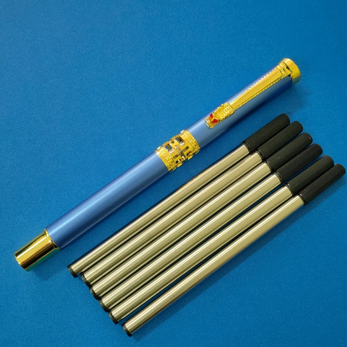 1 blue pen + 6 black refills