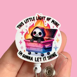 Glitter My Badge This dumpster fire nurse badge reel for nurse and hospital workers. Badge clip Badge pull - Retractable swivel clip with a 360 rotation. Great gift for coworker.
