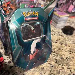 Pokemon TCG Triple Whammy Tin Darkrai - Includes Foil Card & 3 Booster Packs - Features Larvitar Pupitar Tyranitar Sableye Spiritomb & Slakoth Vigoroth Slaking - Perfect for Collectors