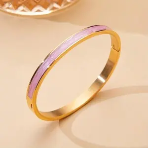 Elegant Gold Tone Bangle with Pink Enamel Accent for Women's Fashion Jewelry