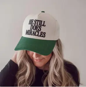 He Still Does Miracles Trucker Hat