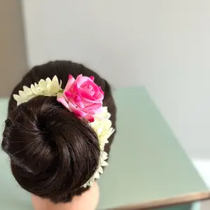 White hair gajra with rose headband.