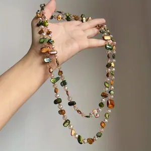 This vintage bohemian multicolored shell beaded double-layer necklace is a retro, light-luxury vacation long necklace that can be stacked.