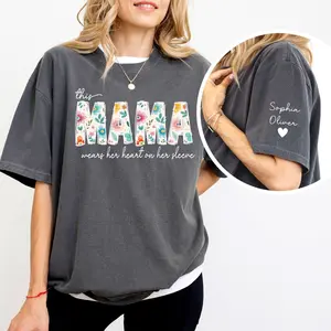 Custom This Mama Wears Her Heart On Her Sleeve T-shirt, Personalized Mom With Kids Names Apparel, Motherhood Hoodie, Mother's Day Gift