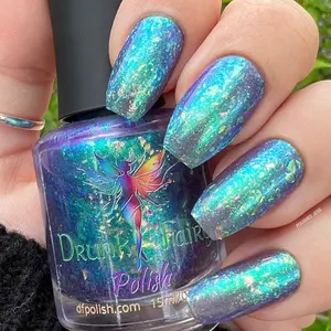 Craic Nail Polish by Drunk Fairy Polish | A Darkened Violet Blue Jelly Base Loaded with Extra Large Aurora Flakes that Shine from Green to Gold to Blue to Purple with an Ultra Aurora Shifting Shimmer from Emerald to Blue to Violet