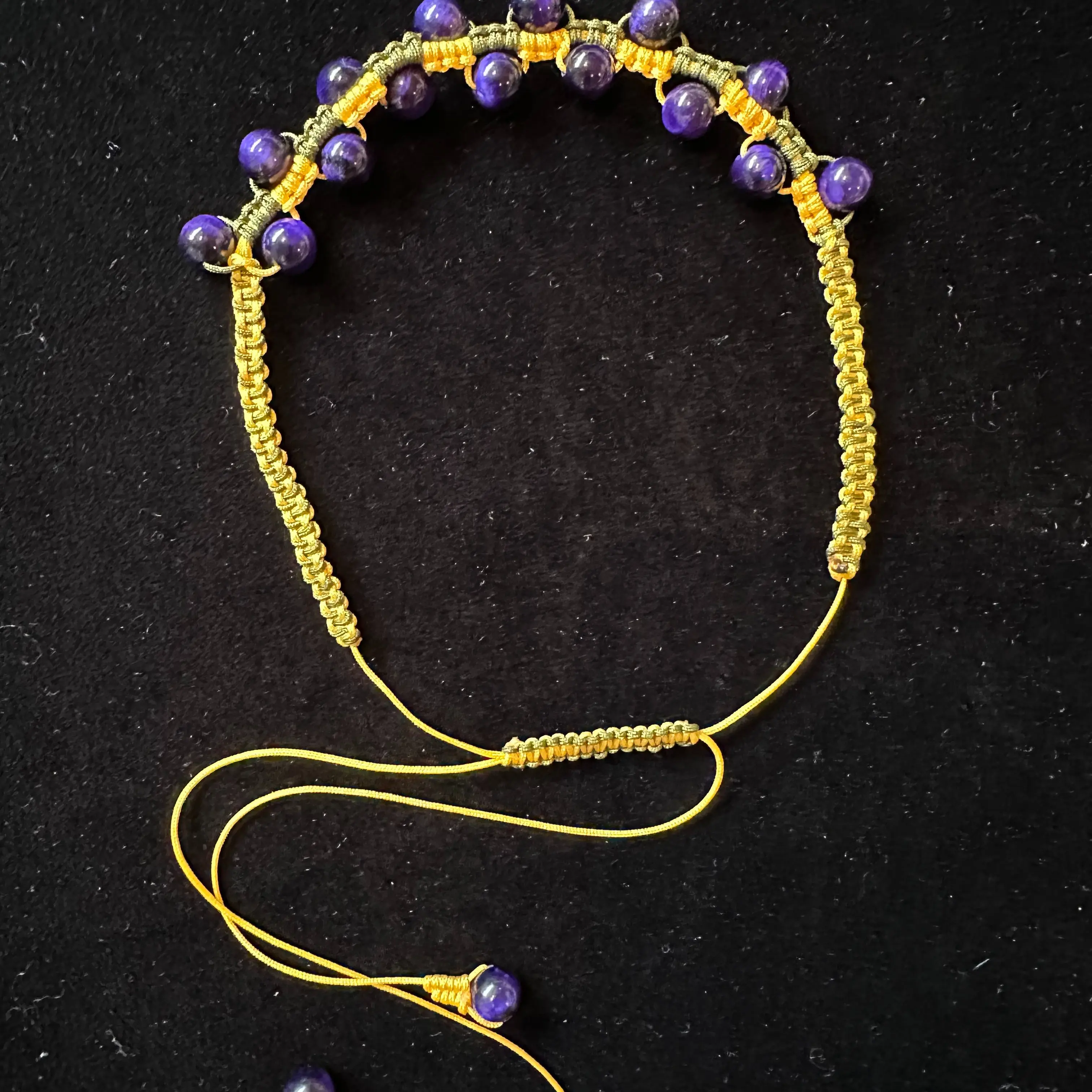 Purple tiger eye with dragon bone knotting