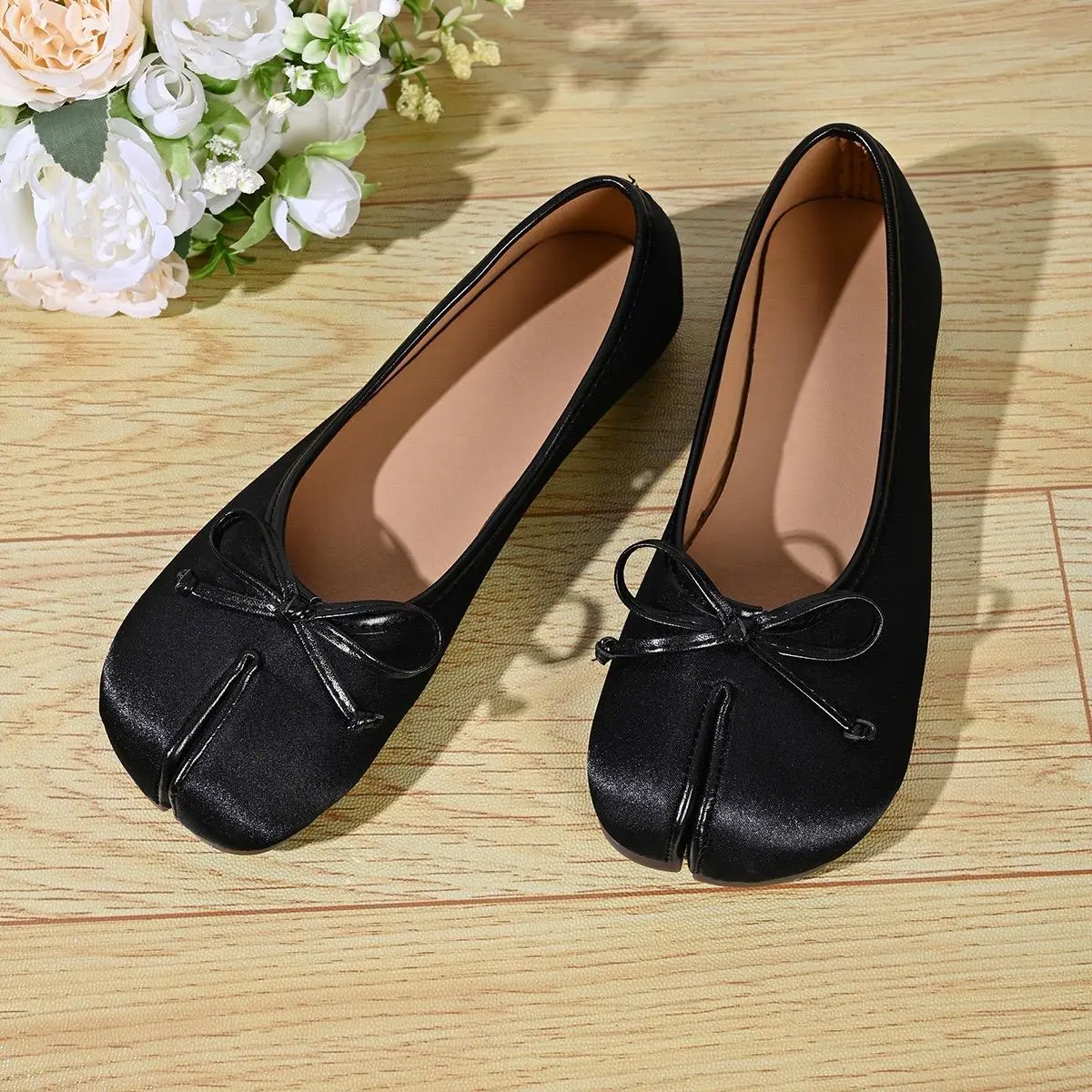 Women’s satin ballet flat slip-on shoes with bow detail, soft leather, available in black and pink—elegant for everyday wear, office, dates, and commuting.