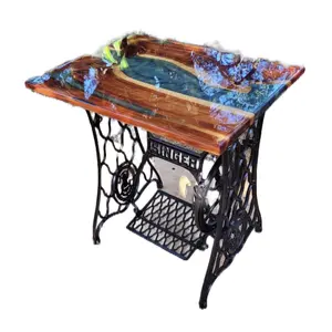 Custom epoxy river table added onto an antique singer sewing machine. Turned out absolutely beautiful!