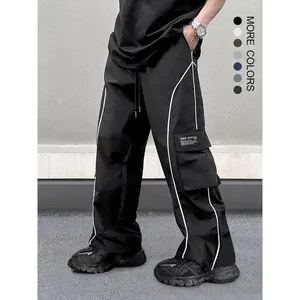 Men’s loose cargo pants with letter patches, contrast piping, pocket details, and a drawstring waist; men’s casual trousers suitable for spring, autumn, and winter