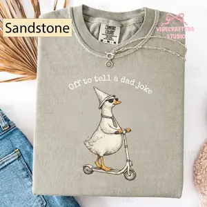 Women's Casual Streetwear Unisex T-Shirt - Funny Duck, Off To Tell A Dad Joke, Cute Goose Scooter Graphic - Sandstone Comfort Colors Seamless Spandex Fabric Apparel