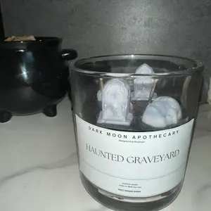 Dark Moon Apothecary Haunted Graveyard 12oz Candle Wicked Scented Black Soy Wax with Gray Tombstones Skull & Spider Garnish 40-60 Hour Burn Time Decor Flower Floral