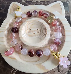 Fire Quartz flowers, butterfly & lucky charms bracelet