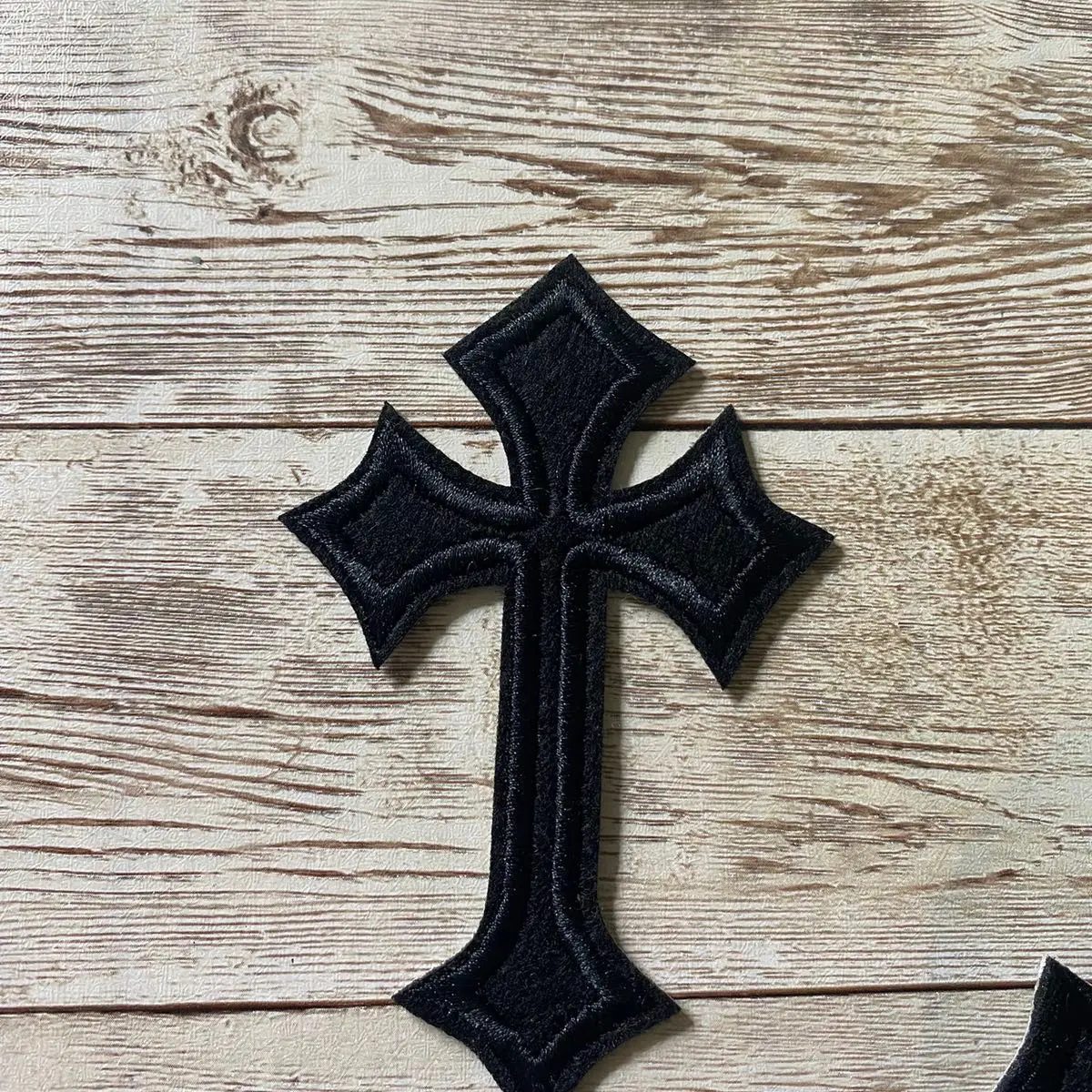 Black cross patch