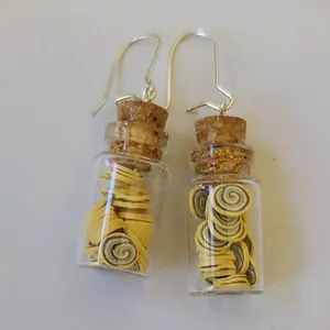 Glass Bottle Earrings With Cinnamon Rolls.