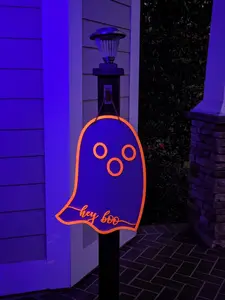Transform Your Space with "Hey Boo" Ghost Door Hanger: 16x20 Inches of Playful Whimsy. Crafted from 5mm Plywood, Dual Layers for Dimension. UV Glow Neon Orange Outline for Mesmerizing Effect. Jute String for Easy Hanging. A Must-Have Halloween Decoration!